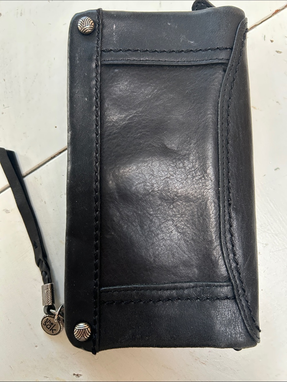 The Sak Black Leather Wristlet Wallet with Silver Accents